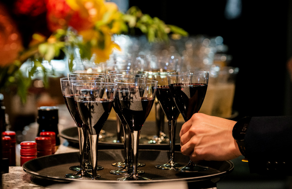 - Providing food and beverages in the hospitality lounge.
